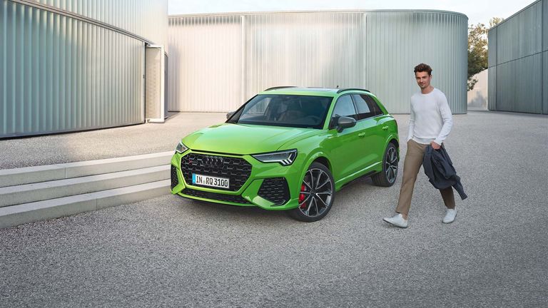Frontal side view of the RS Q3 with man on the side